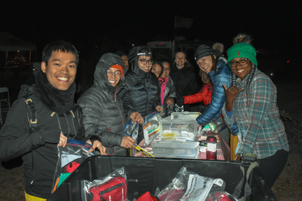 participants gather around materials at a Tier 1 Trip Safety workshop